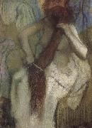 The woman doing up her hair Edgar Degas